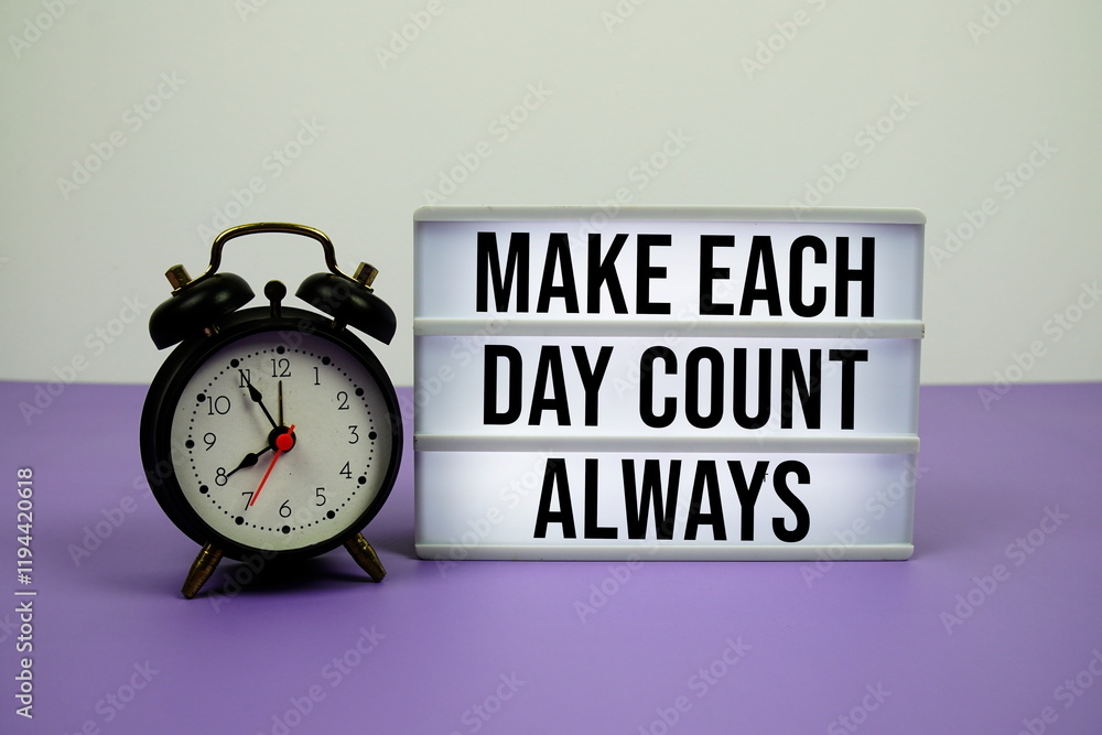 Poster make each day count always text on led lightbox with alarm clock on purple background