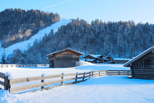 Alpine village under a snowy mountain