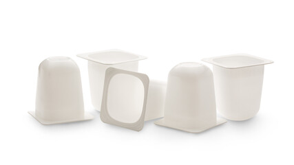 Empty crushed plastic yogurt pots