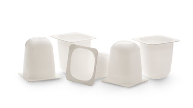 Empty crushed plastic yogurt pots