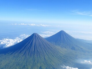 Majestic Twin Volcanoes Soaring Above Cloudscape Serene Blue Sky