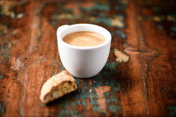 Cup of coffee and Cantuccini (Italian cookie) on dark wooden background. Copy space.