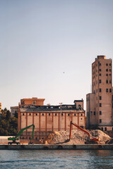 loading point of building materials on the shore of the bosphorus. loader in a construction depot