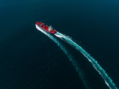 container ship sailing full speed with beautiful wave pattern line, cargo logistic and transportation import export of International,