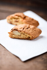 Cantuccini (Italian cookies) on dark wooden background. Close up