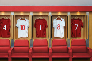 Football changing room in a large stadium with different players' jerseys