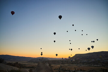 Balloons lifted into the air in Cappadocia. Entertainment and tourist attraction. A spectacular sight