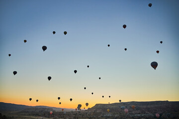 Balloons lifted into the air in Cappadocia. Entertainment and tourist attraction. A spectacular...