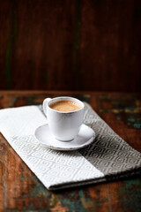 Cup of coffee on wooden background. Soft focus. Copy space.