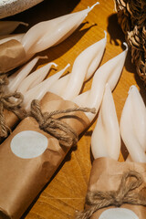 wax candles in the form of a spiral on the store counter. designer light candles for dinner