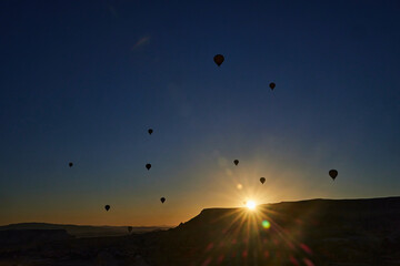Balloons lifted into the air in Cappadocia. Entertainment and tourist attraction. A spectacular sight