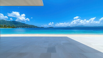 Tropical Beach View: A panoramic view of a pristine tropical beach, with crystal clear turquoise water lapping the shore, white sand, lush green hills in the distance.