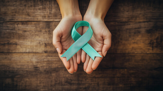 Hands holding blue ribbon