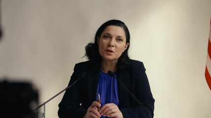 U.S. female official delivers a speech during an official press conference