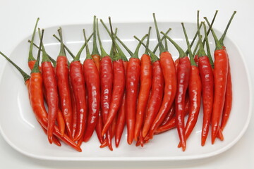 A group of red hot chili peppers and green hot chili peppers are ripe for bring to be a ingredient.