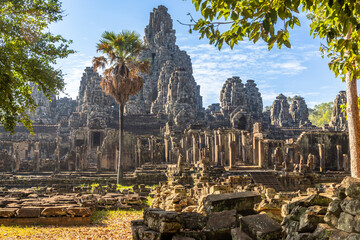 Ruins of Ancient Bayon temple with carved stone faces, Angkor Thom, Siem Reap, Cambodia