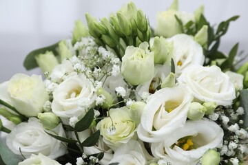 Beautiful wedding bouquet on light background, closeup.