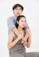 Portrait of young asian happy attractive cheerful couple love, Joyful sweethearts hugging embracing cuddle enjoy good time romantic date, posing to camera smiling sitting together on white background