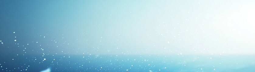 Fototapeta premium Sparkling water droplets glisten in the sunlight above a serene ocean environment