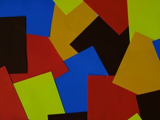 Textured colorful paper scraps create vibrant artistic backgrounds. Randomly scattered colorful papers for abstract artistic backdrop.