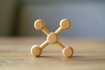 Obraz premium Wooden Toy Sculpture on a Natural Wood Surface, Simple Playful Design, Minimalistic Aesthetic, Handcrafted Art Piece for Children and Adults Alike, Calm Background Blur