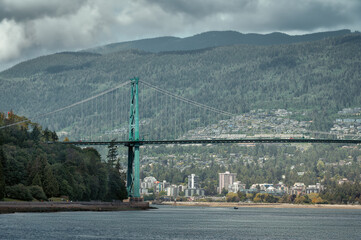 Beautiful view of the Lions Gate Bridge connecting the North Shore with Downtown Vancouver as seen from Stanley Park during a day time in Vancouver, British Columbia, Canada