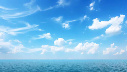 Obraz premium A serene view of the blue ocean and the cloud - dotted sky, natural colors,