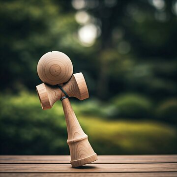 a wooden kendama toy with the ball mid-air, captured in motion with a blurred background of a Japanese garden.