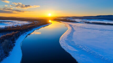 Fototapeta premium Aerial View of Scenic Winter River Under Beautiful Sunset in La