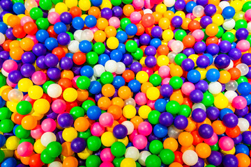 A dazzling mix of vibrant balls in a cheerful playground setting.