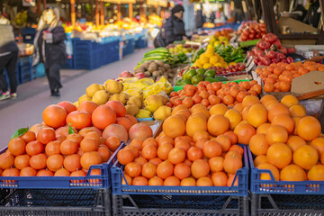 Colorful display of fresh fruits on a market stand. Represents abundance, healthy eating
