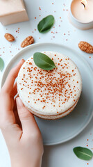 Delicious vanilla cake with sage leaf and spices on a ceramic plate
