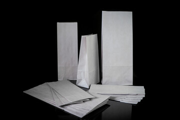 Set of paper bags for shopping on black background. Mockup for design