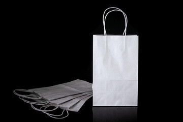 Set of paper bags for shopping on black background. Mockup for design