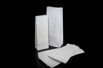 Set of paper bags for shopping on black background. Mockup for design
