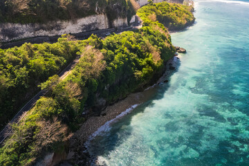 High angle view background of tropical coast cliffs and blue sea in Bali, Indonesia