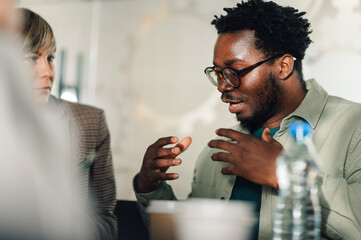 Creative marketing professional explaining strategy during business meeting