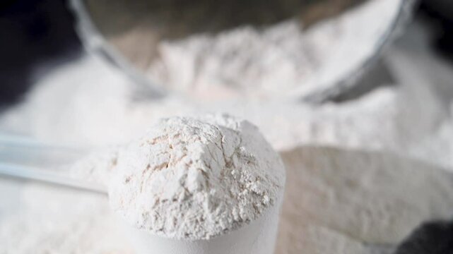 Amino acid food supplement, creatine powder in a measuring scoop, Sports nutrition 