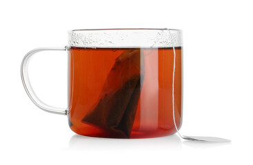 Tea bag in glass cup with hot drink isolated on white