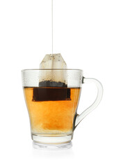 Brewing aromatic tea. Cup with teabag isolated on white