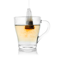 Brewing aromatic tea. Cup with teabag isolated on white
