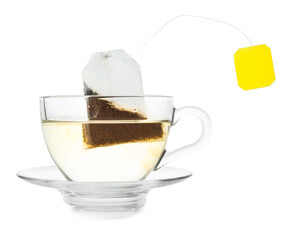 Brewing aromatic tea. Cup with teabag isolated on white