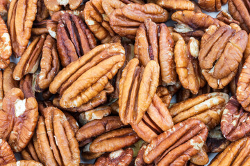 Pecan halves on a white background. Nuts.