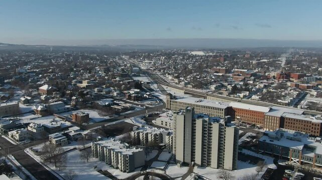 Downtown Utica, NY Aerial Looking Southwest on cold winter morning, pull back to reveal new Wynn Hospital