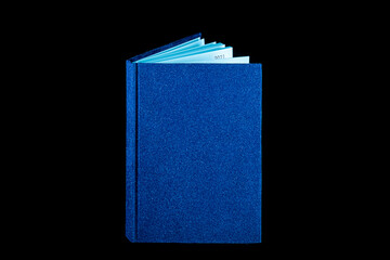 close up of a blank velour fluffy notebook on black background with clipping path