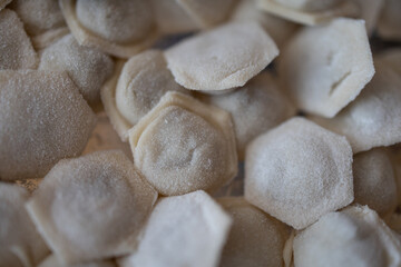 Preparing the dumplings stuffed with minced meat and onion