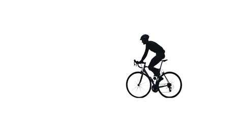 Naklejka premium A man is riding a bicycle on a road