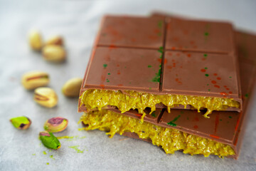 Trend Dubai chocolate with pistachio paste and kataifi dough. Confectionery handmade sweets at home in the kitchen. 