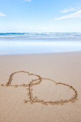 Two hearts drawn in the sand at Fuerteventura beach