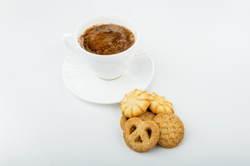 Danish cookies on a white background with coffee in a white cup, freshly brewed American coffee, isolate, breakfast, pastries, delicious shortbread cookies, catalog photo of food, coffee in bed